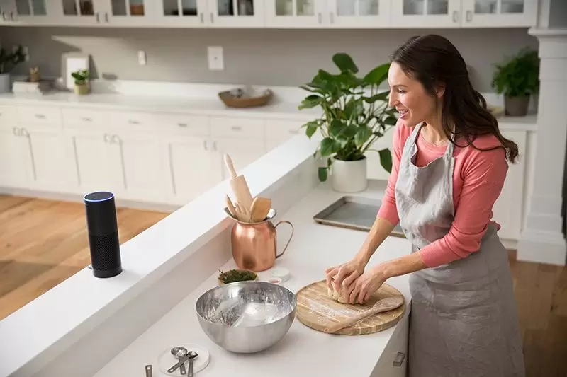woman-using-amazon-echo-kitchen